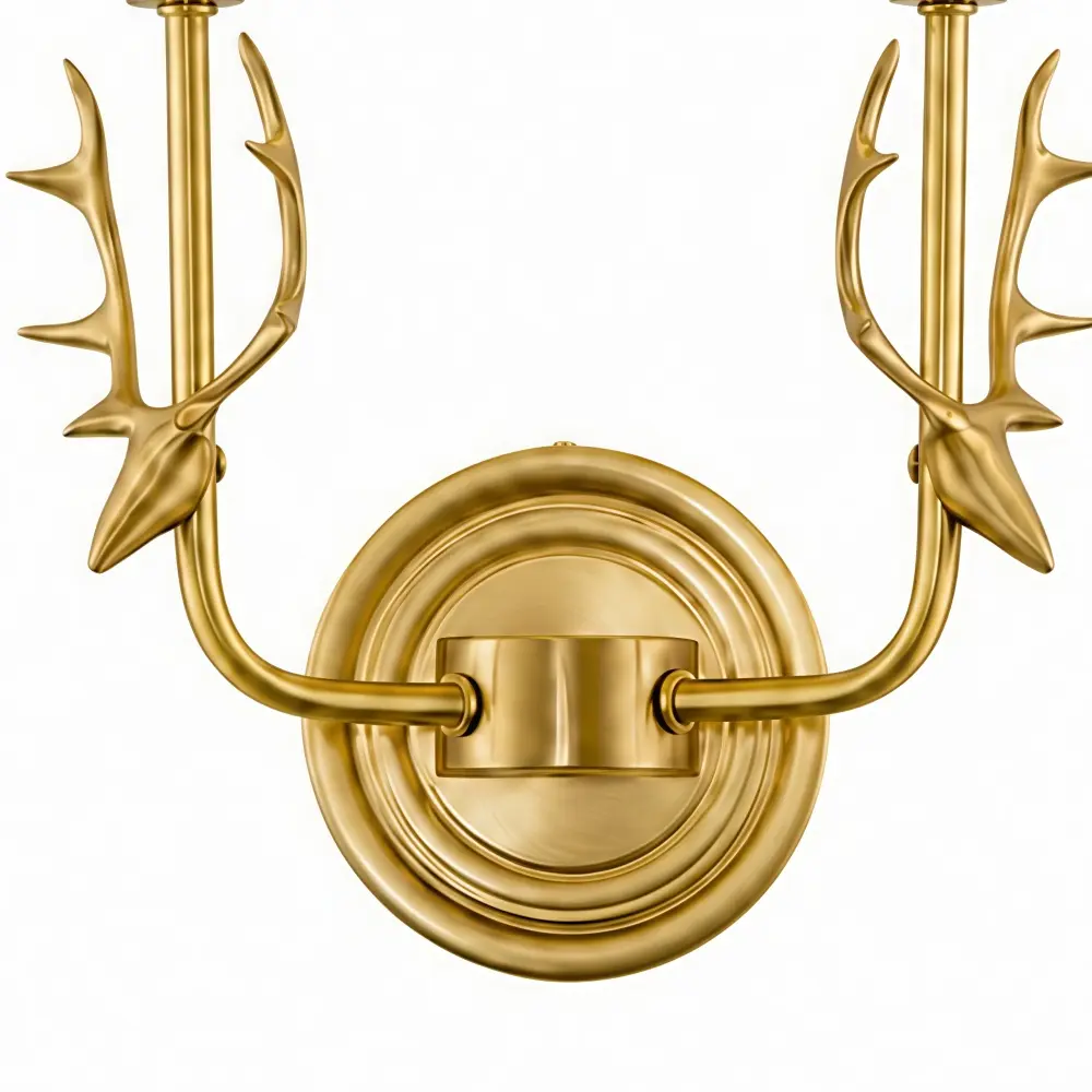 Textured brass wall plate and arm detail