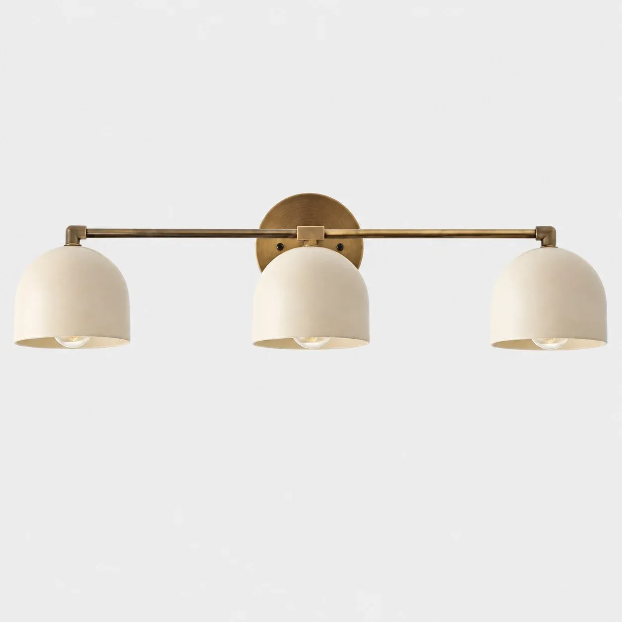 Three-light white shade with antique brass arm