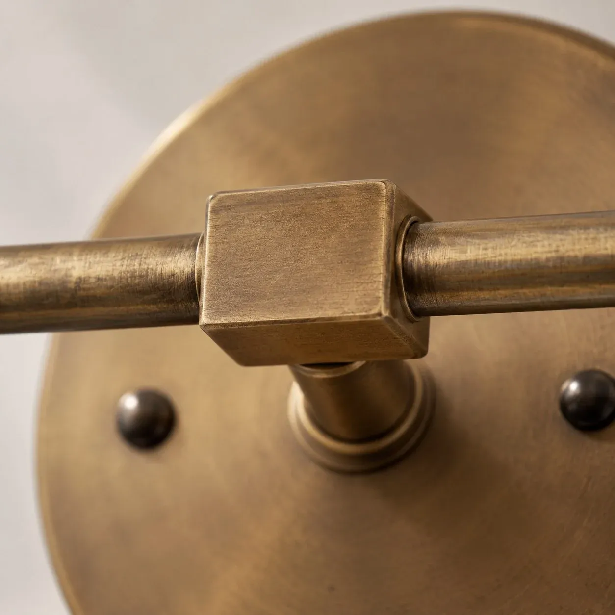 Round antique brass backplate and center hardware