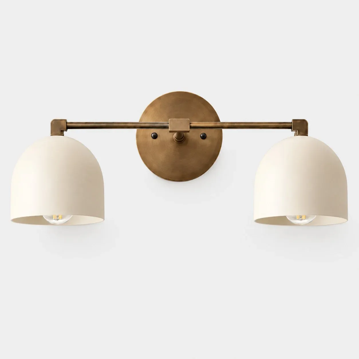 Two-light white shade with antique brass arm