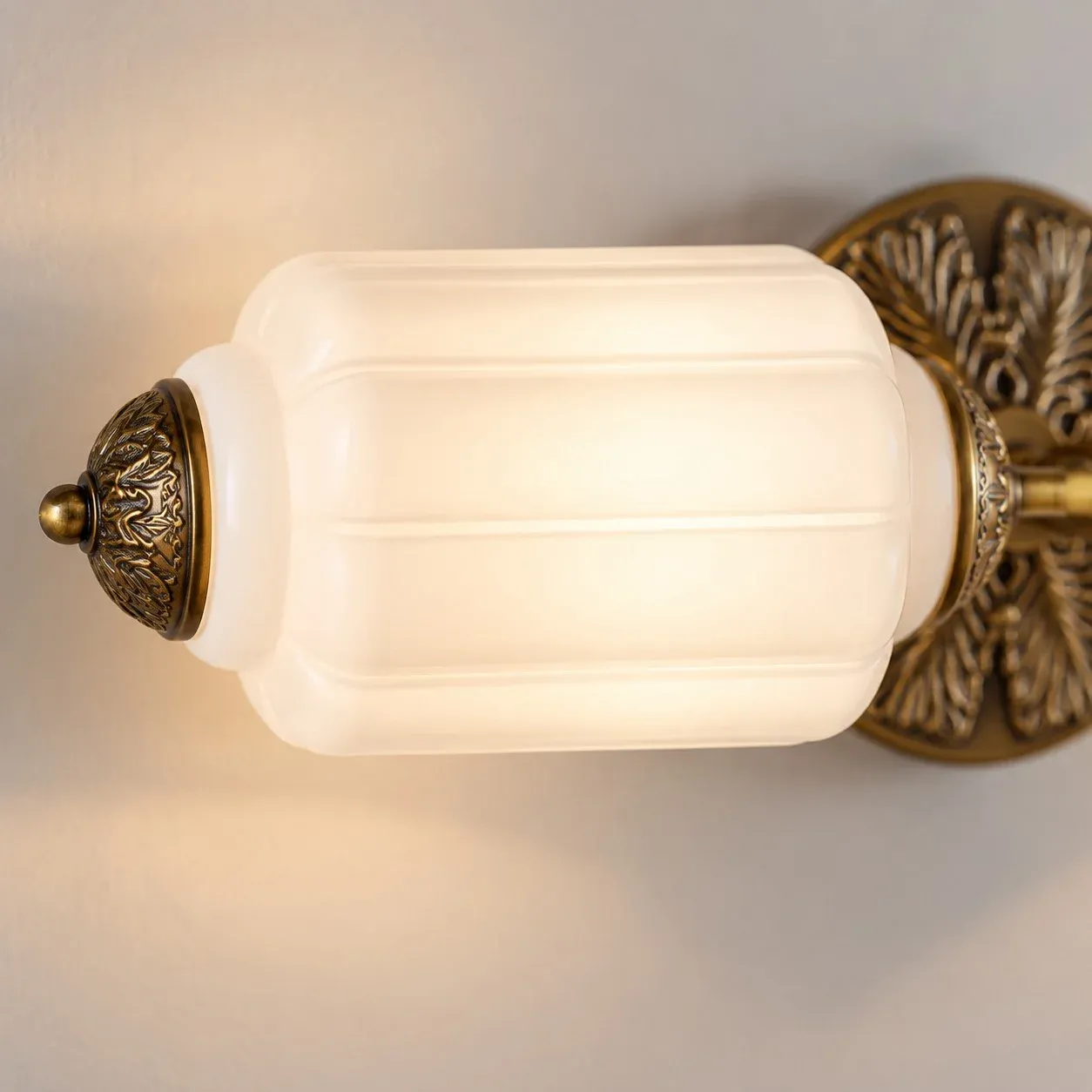 Brass end cap on a ribbed milk glass shade
