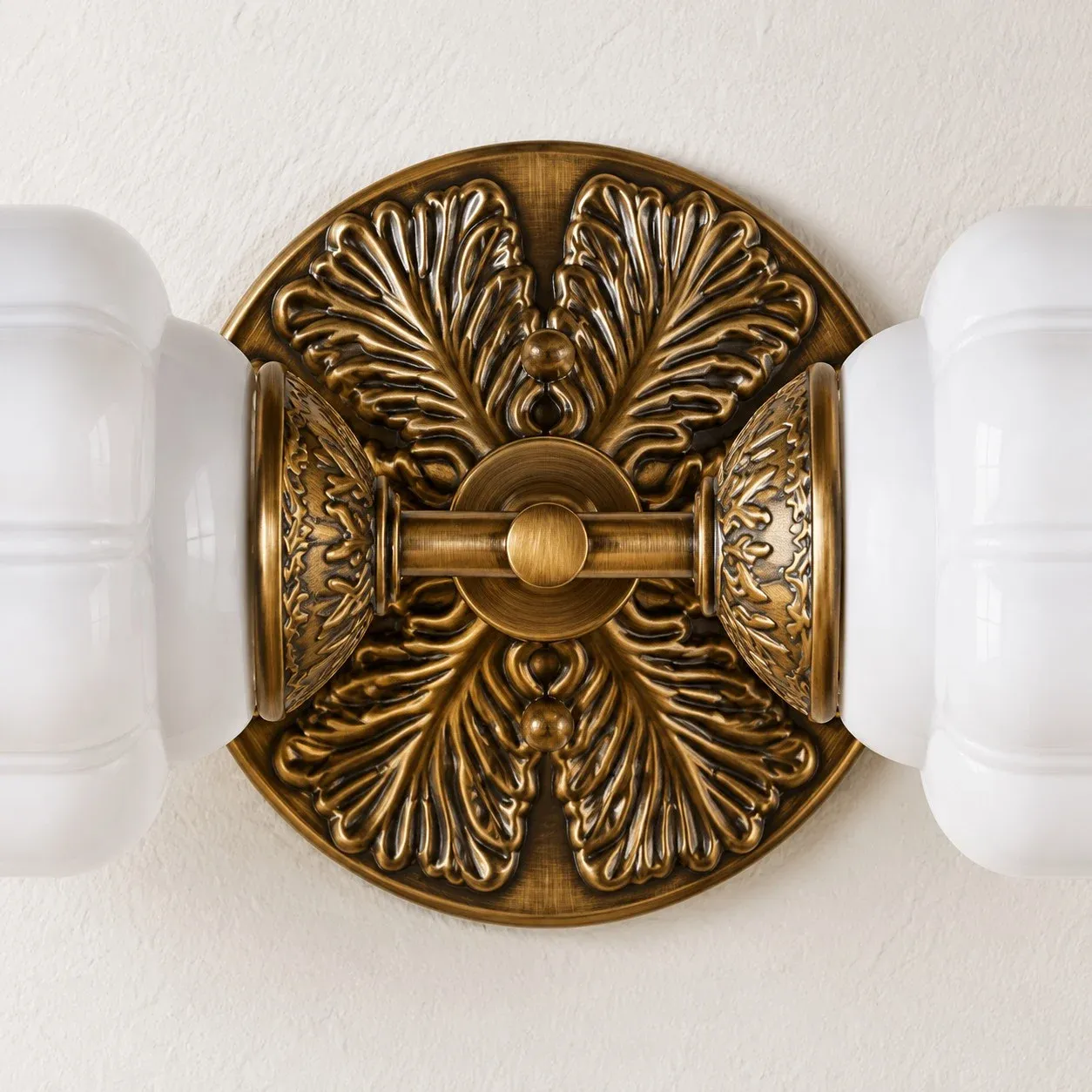 Ornate metal backplate with leaf detail