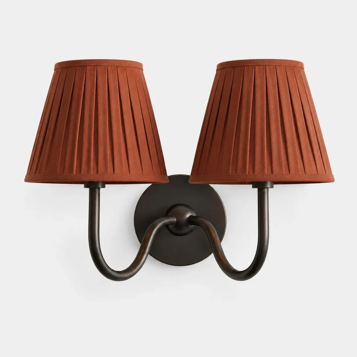 Two-head matte black wall sconce with a red pleated fabric shade