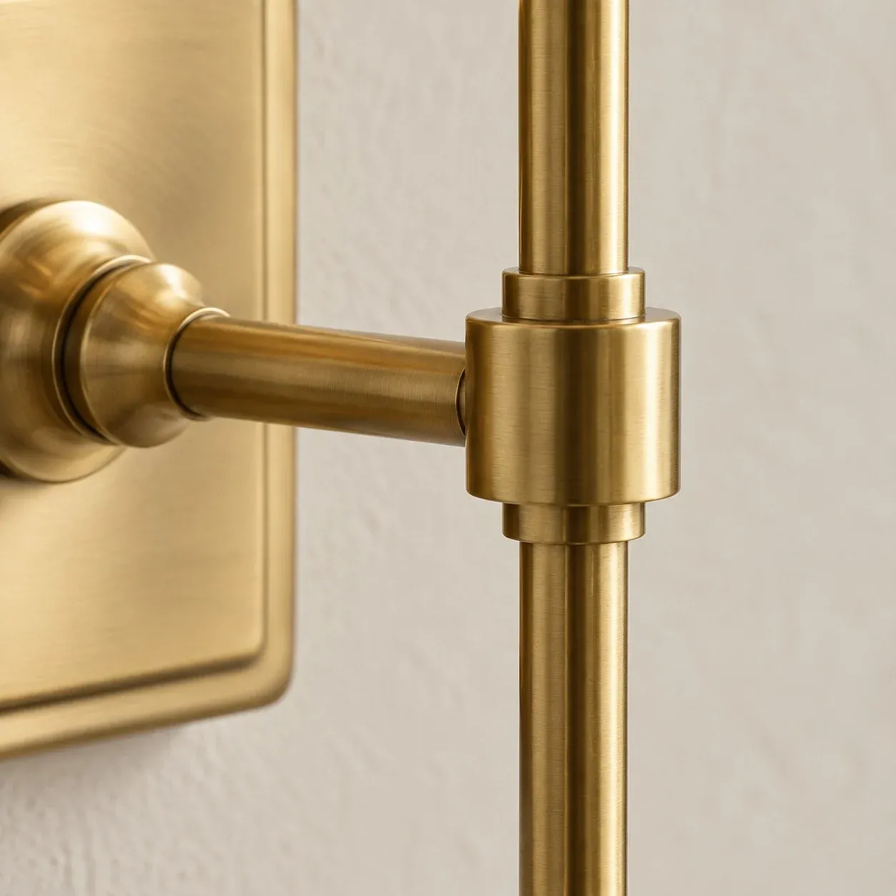 Brass collar joining the arm and stem