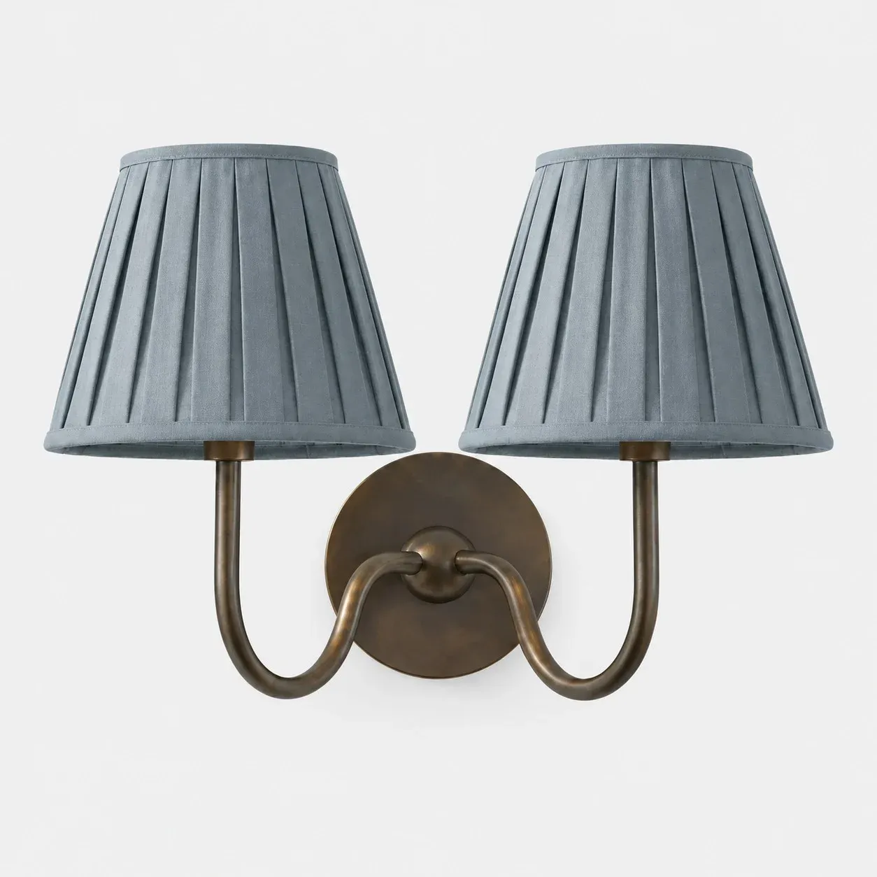 Two-head matte black wall sconce with a mustard yellow plain fabric shade