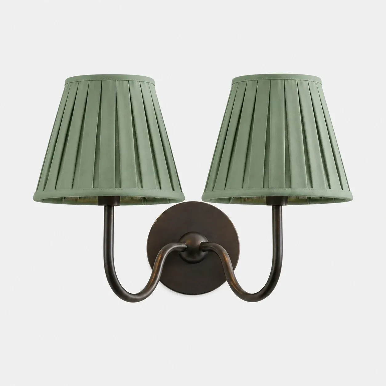 Two-head matte black wall sconce with a sage green plain fabric shade