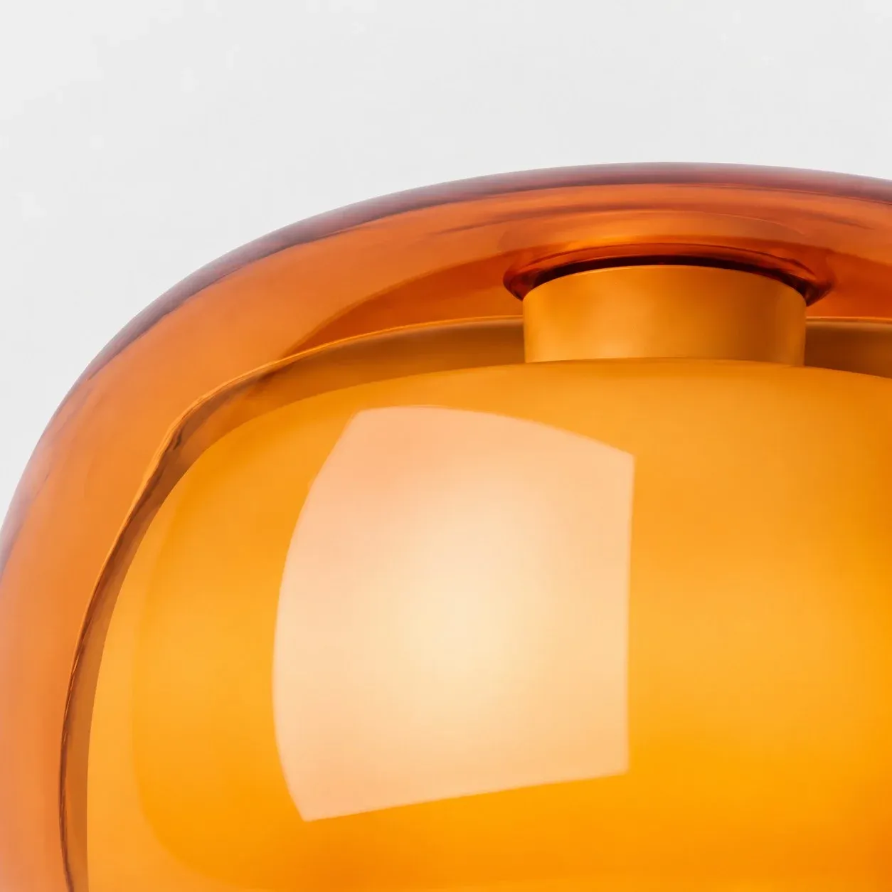 Inner glass mushroom and painted collar inside the amber outer shade