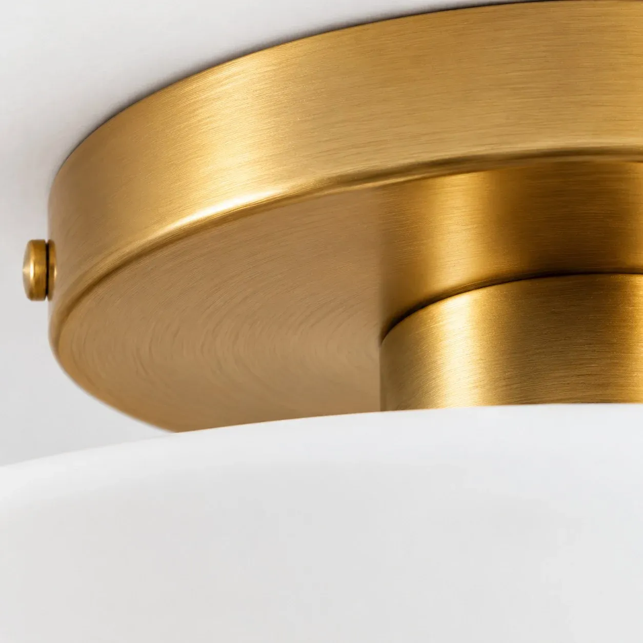 Gold canopy underside meeting the porcelain shade