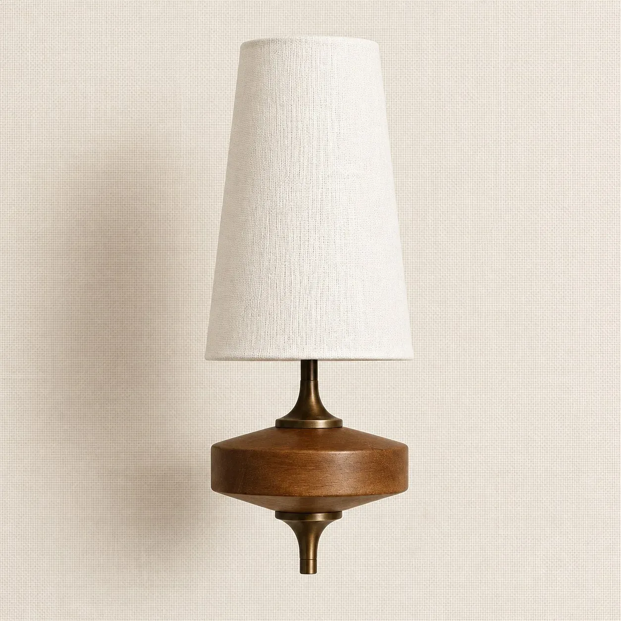 White fabric shade wall sconce on a walnut wood base