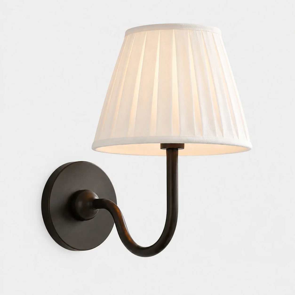 One-head matte black wall sconce with a white pleated fabric shade