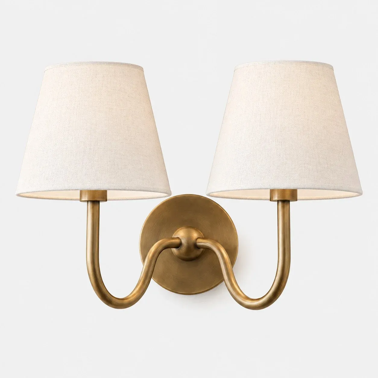 Two-head brass wall sconce with beige fabric shades