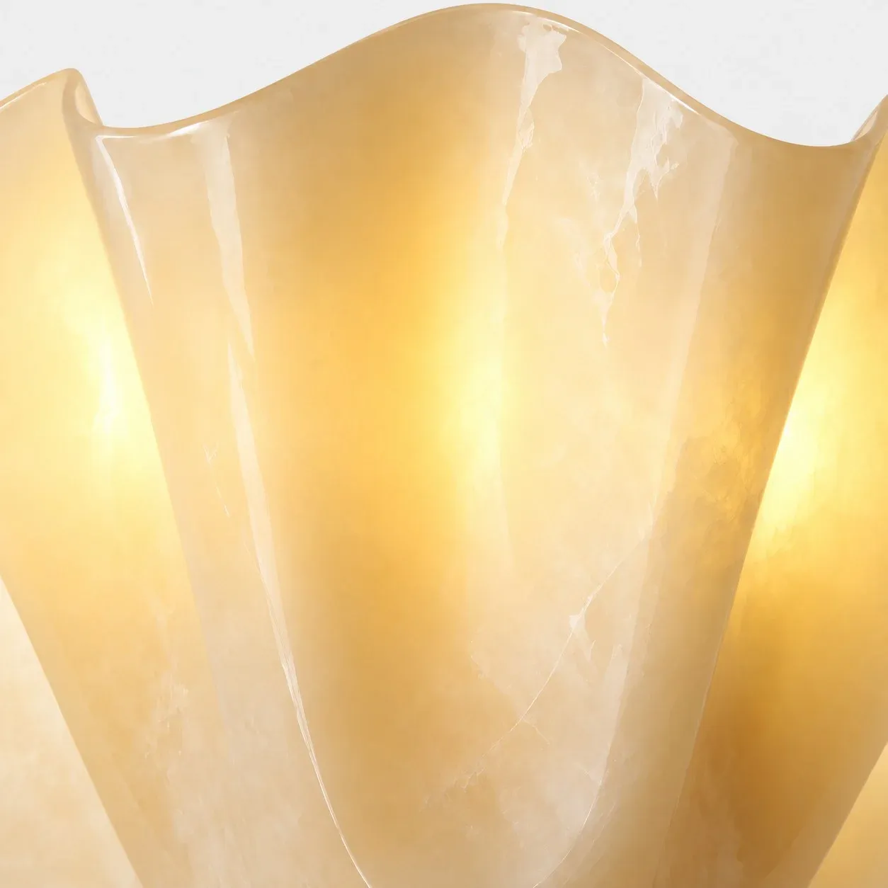 Lit seashell glass with a faint vein across the shade