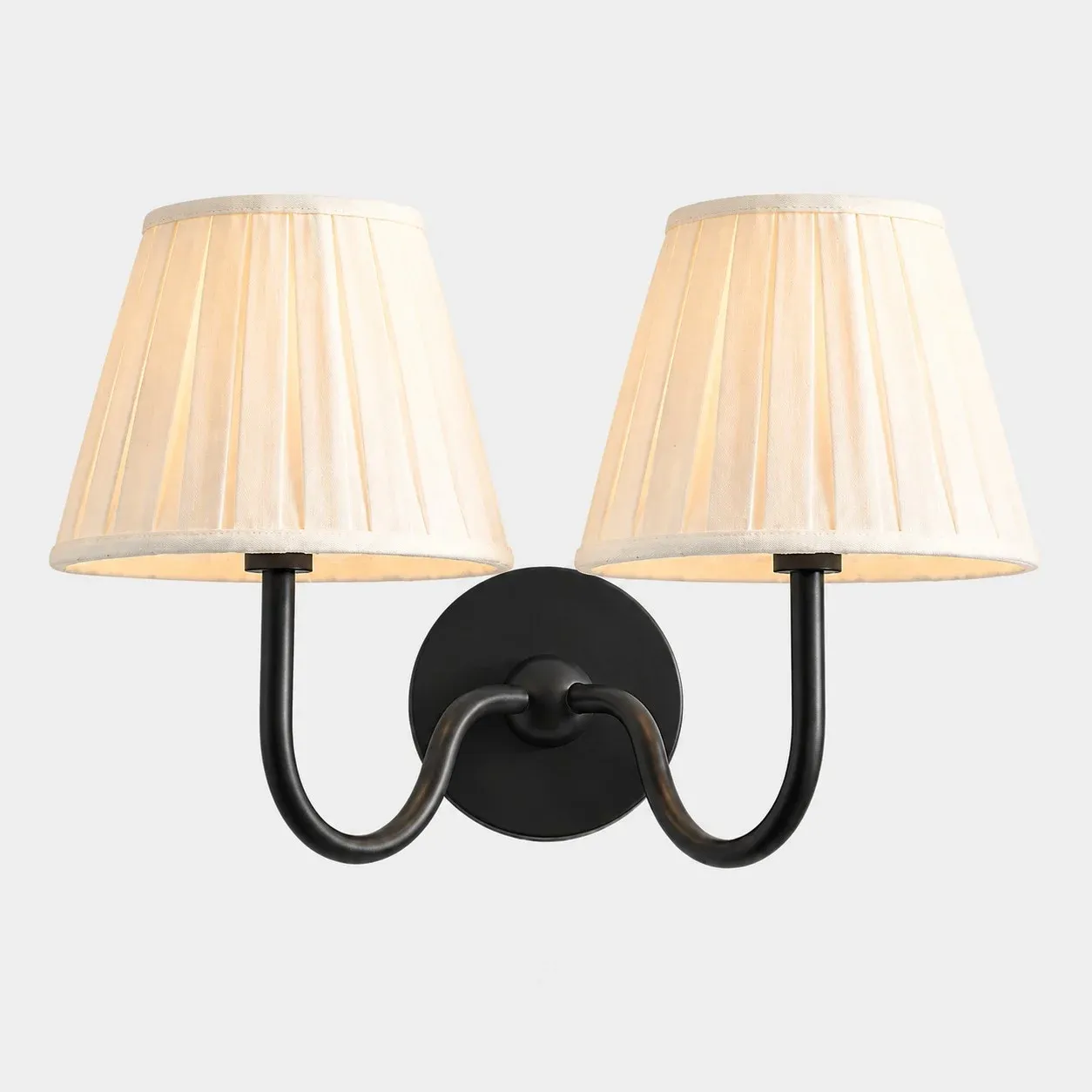 Two-head matte black wall sconce with a white pleated fabric shade