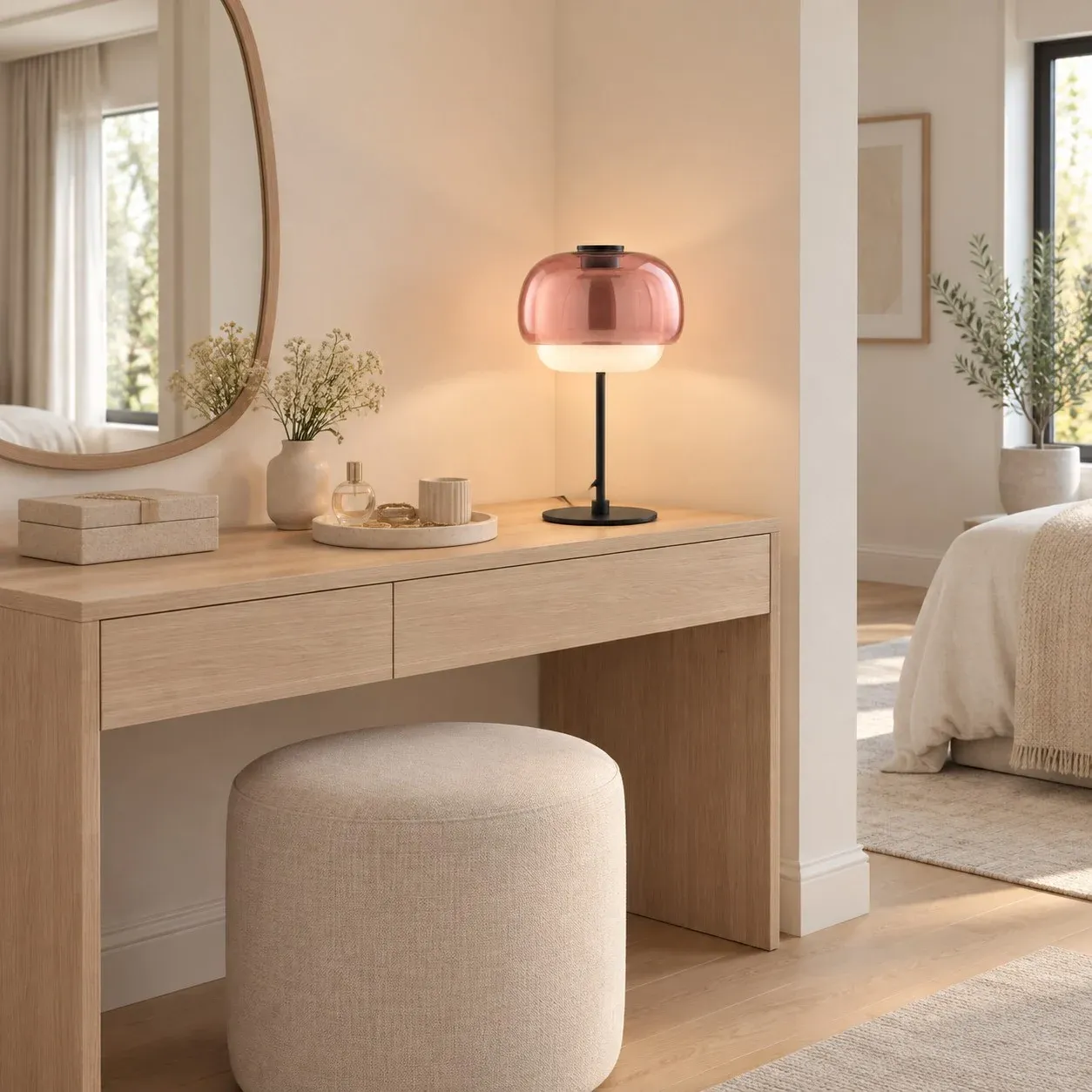 Blush glass table lamp on a dressing table
