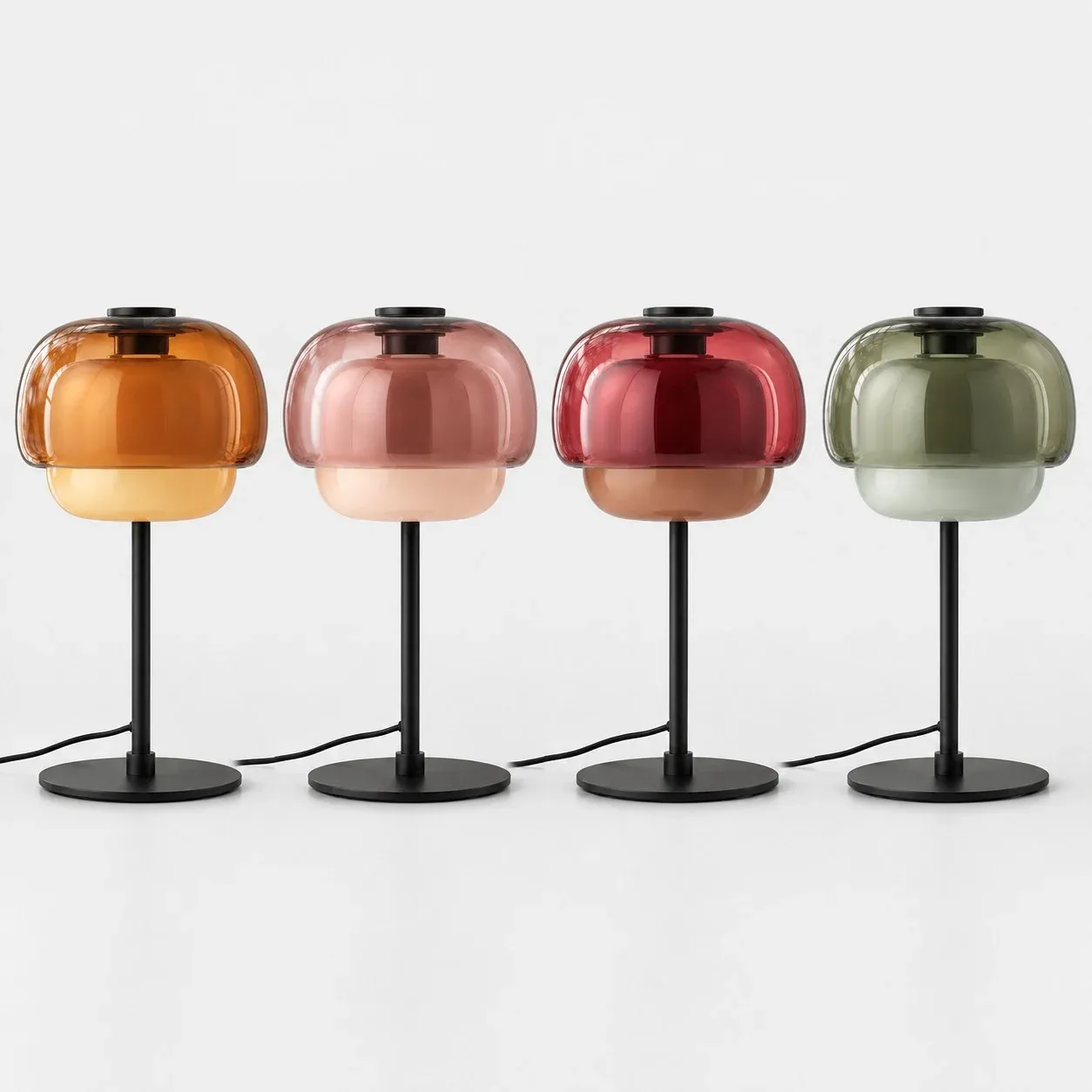 Four glass mushroom table lamps in orange, blush, burgundy, and green