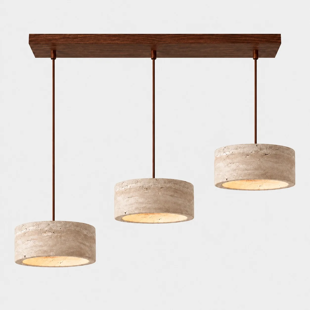 Three cylindrical travertine pendants on a walnut bar