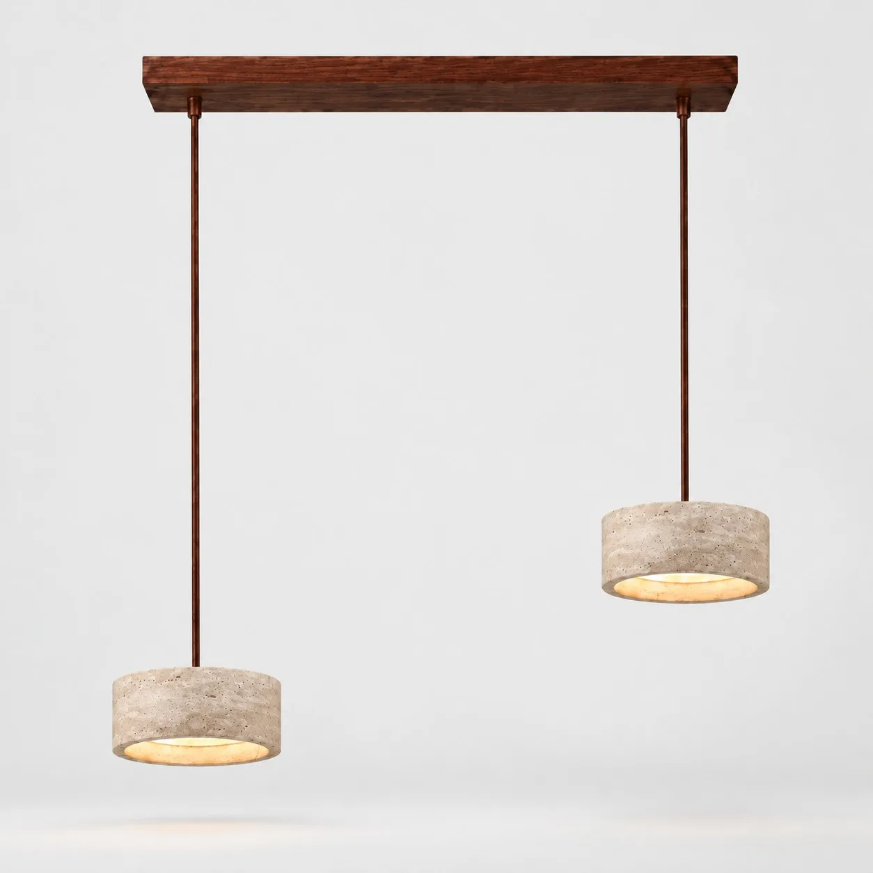 Two small cylindrical travertine pendants