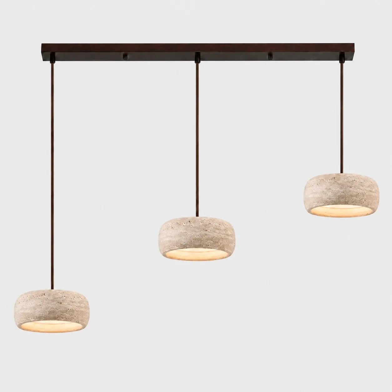 Three small rounded travertine pendants