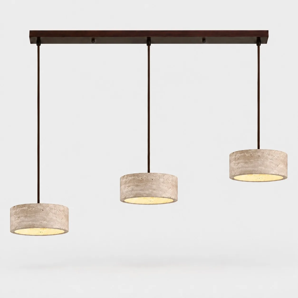 Three small cylindrical travertine pendants