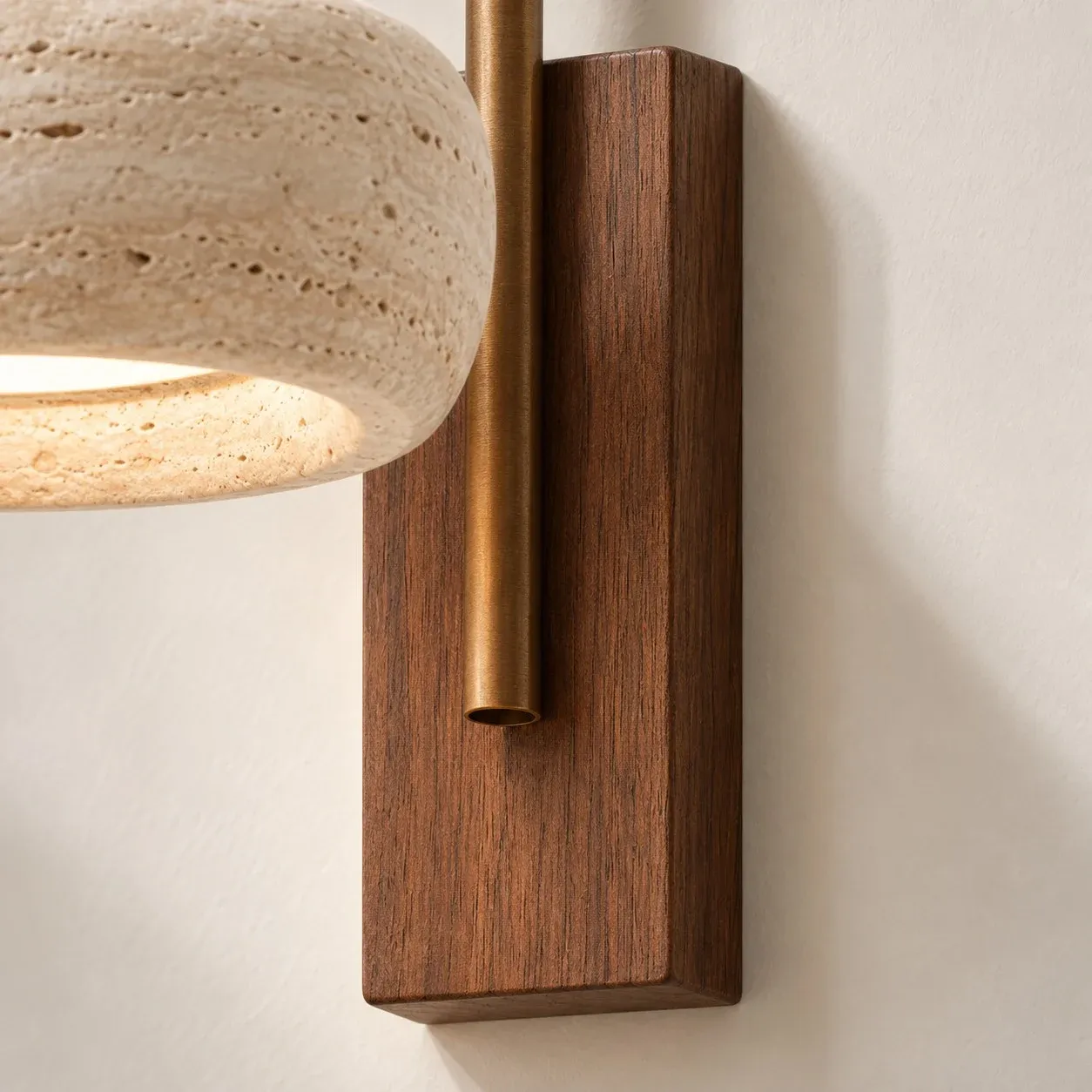 Brass arm passing through a walnut backplate