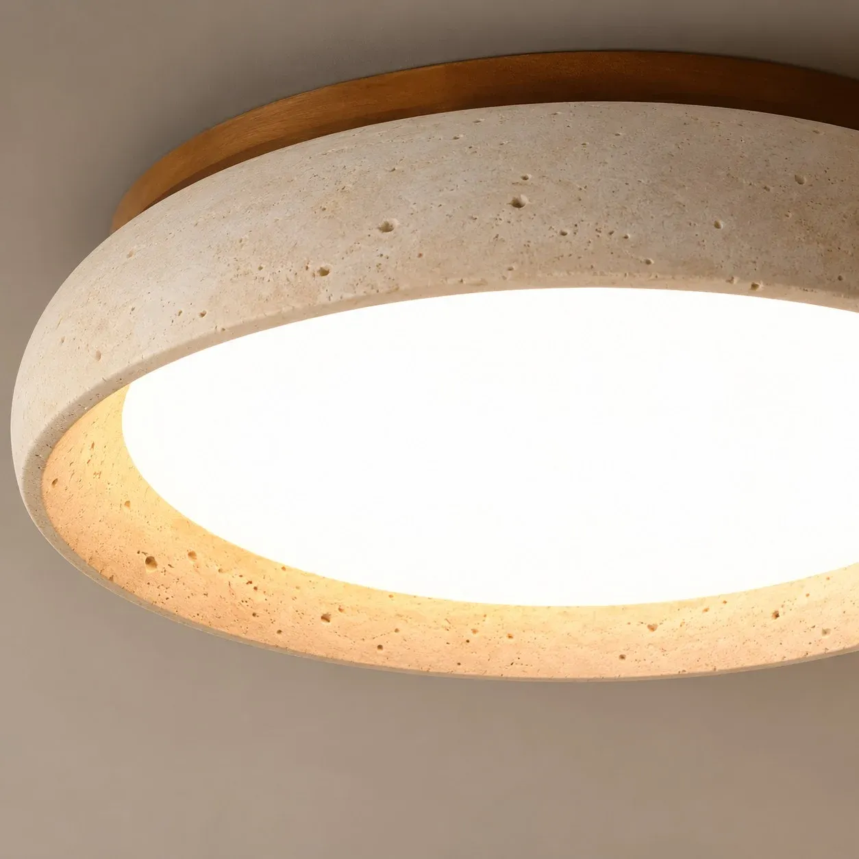 Open underside of the travertine bowl with a lit diffuser
