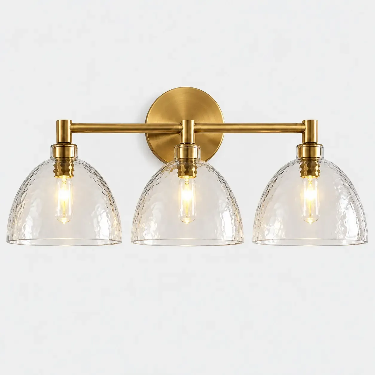 Three hammered glass bell wall sconce in Brass