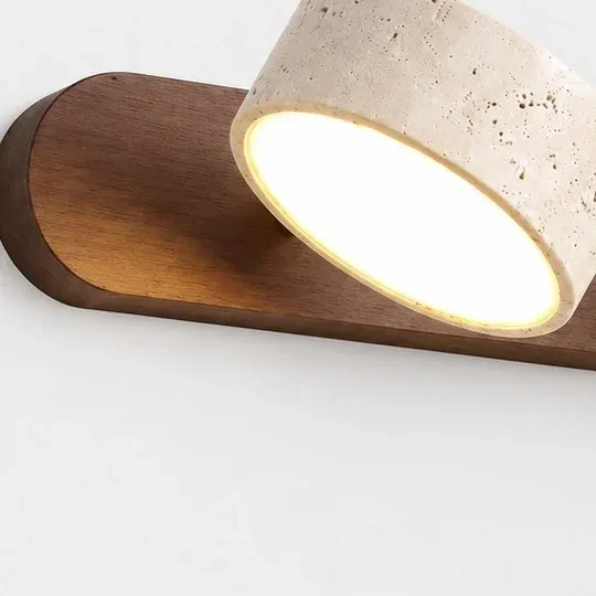 Rounded walnut bar end with a tilted travertine shade