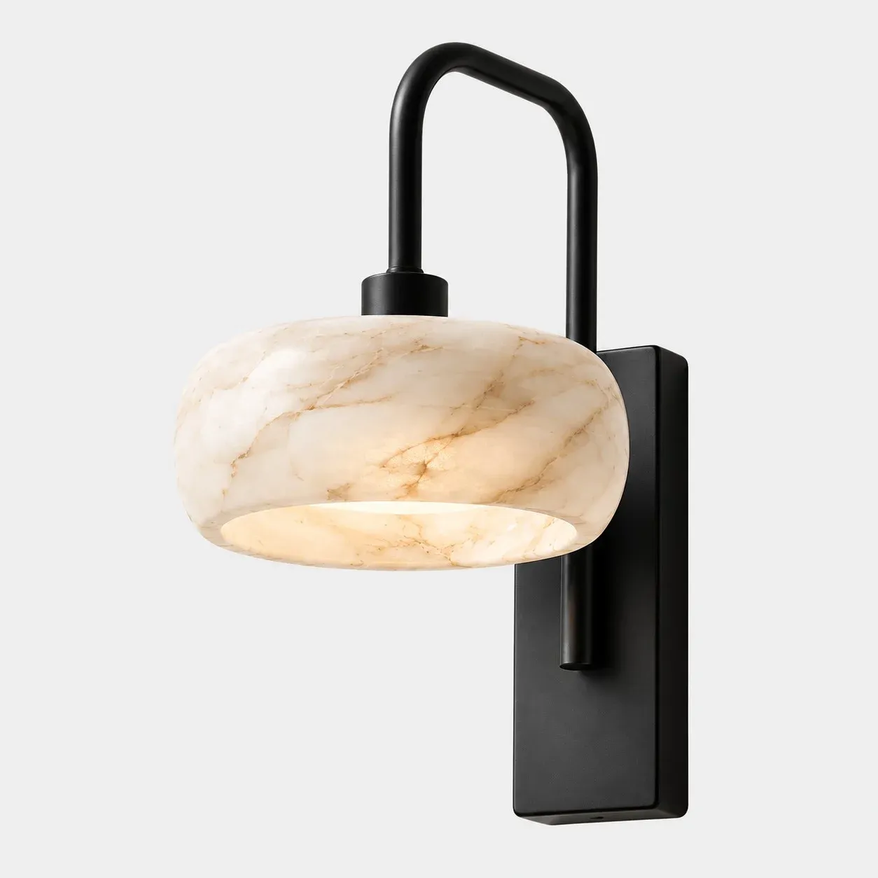 Rounded alabaster shade on a black metal backplate