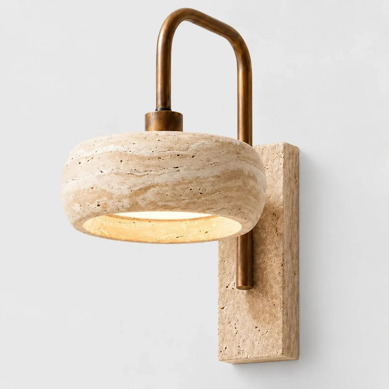 Rounded travertine shade on a travertine backplate