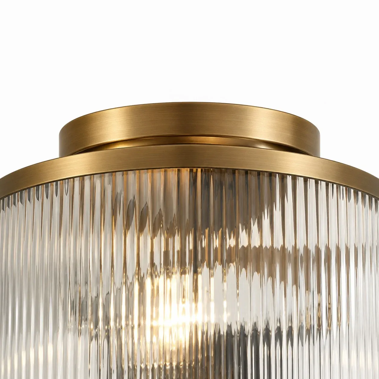 Brushed brass canopy and ring above ribbed glass