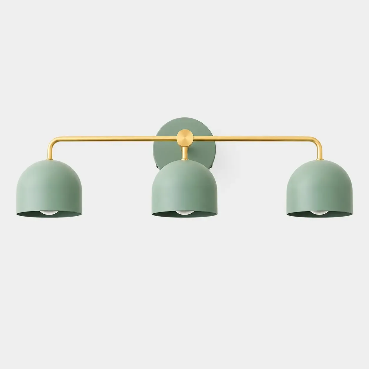Brass three-head vanity sconce with green dome shades