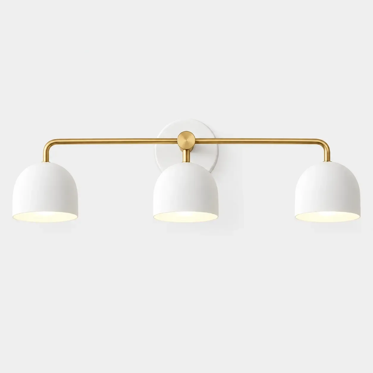 Brass three-head vanity sconce with white dome shades