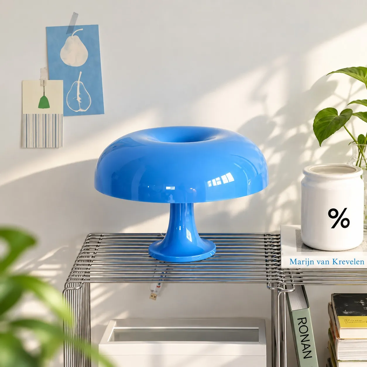 Blue lamp on a wire shelf