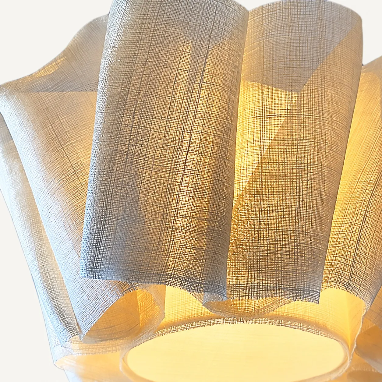 Lit linen folds from below