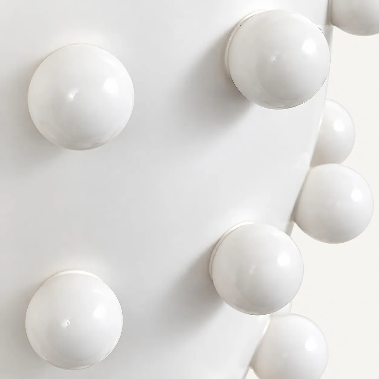 Raised dots on the porcelain base