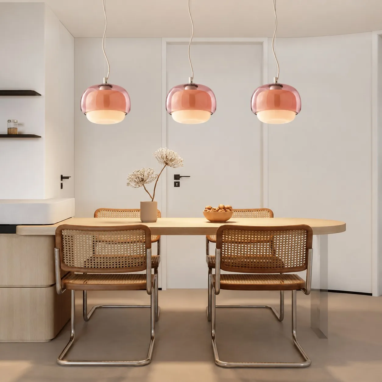 Blush pendants over a dining table