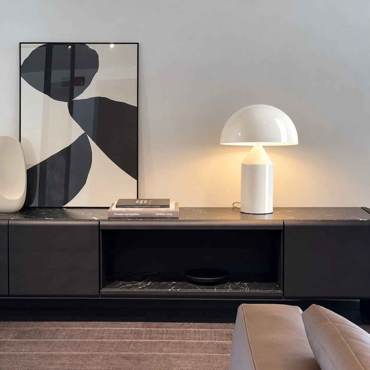 Glossy white mushroom table lamp on a dark console