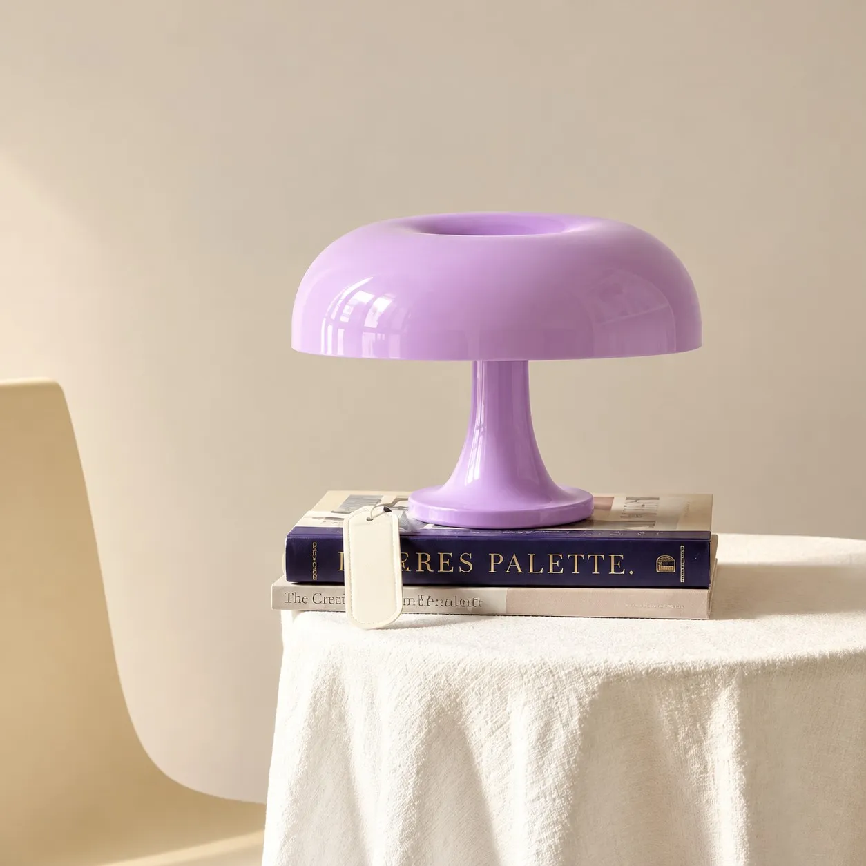 Purple lamp on a stack of books