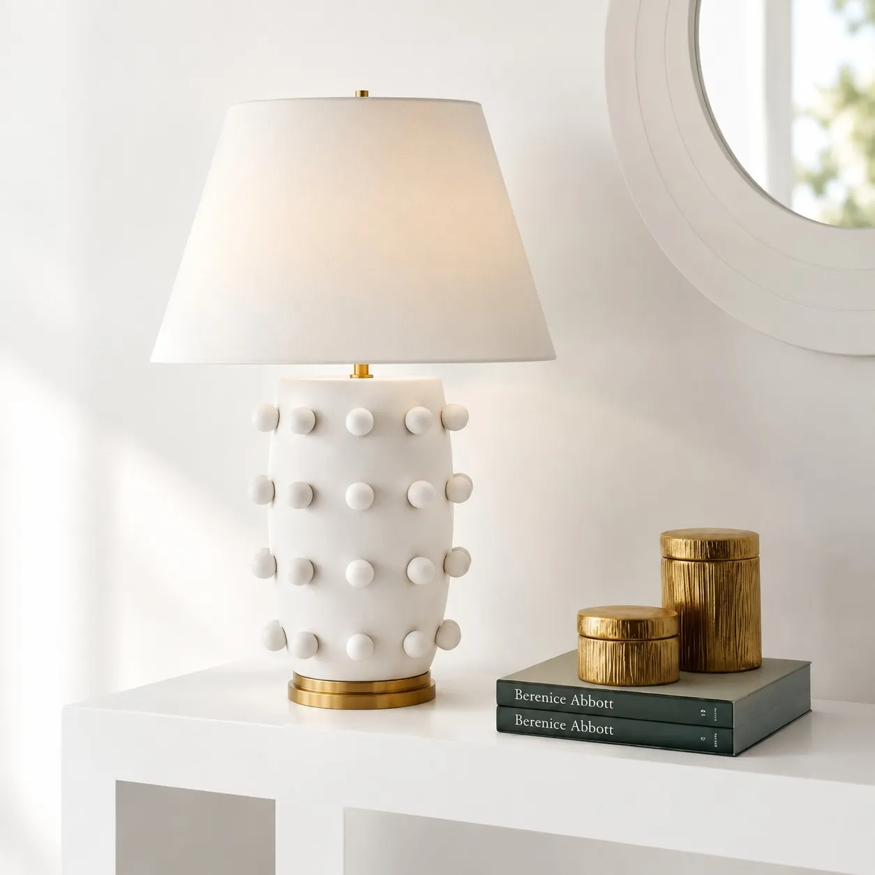 White porcelain table lamp on a white console