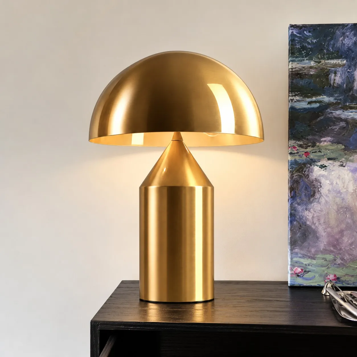 Gold mushroom table lamp on a dark wood top