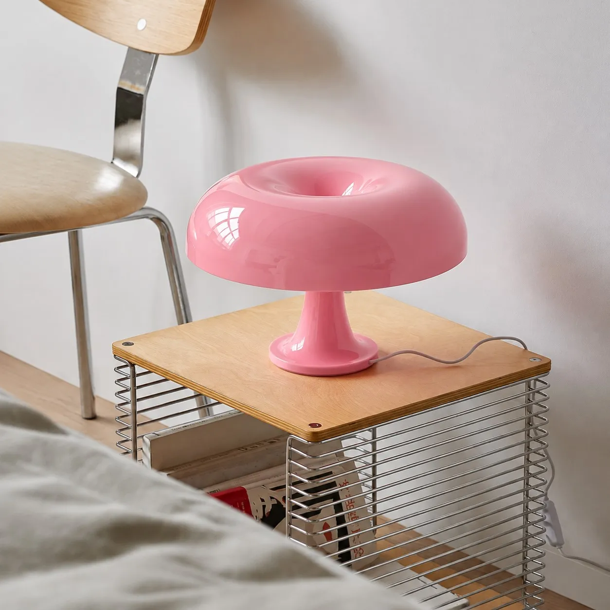 Pink lamp on a bedside table
