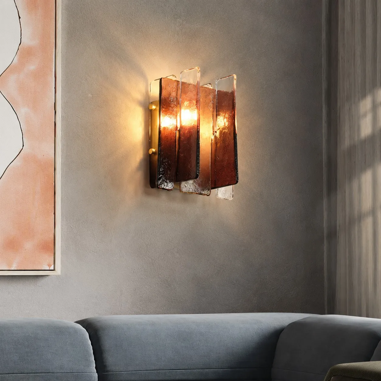 Cognac glass wall light above a sofa