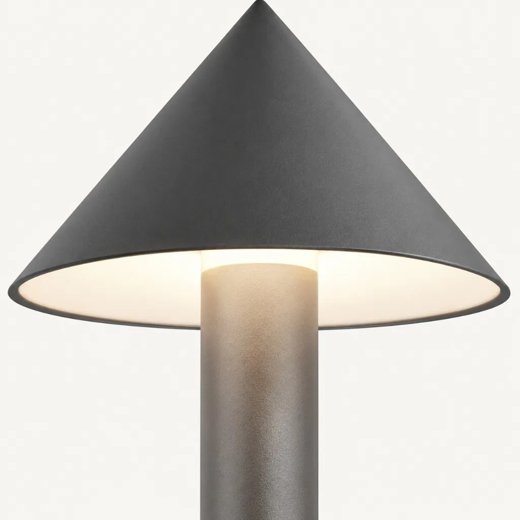 Lit cone shade with warm glow on the stem