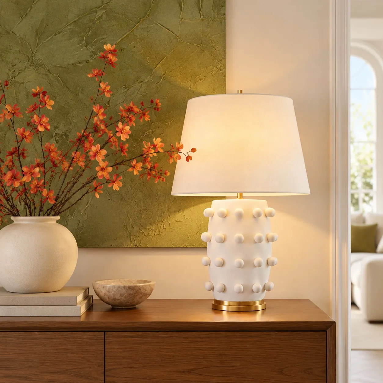 White porcelain table lamp on a wood sideboard