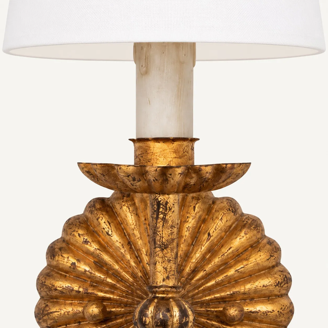 Candlestick under the white fabric shade