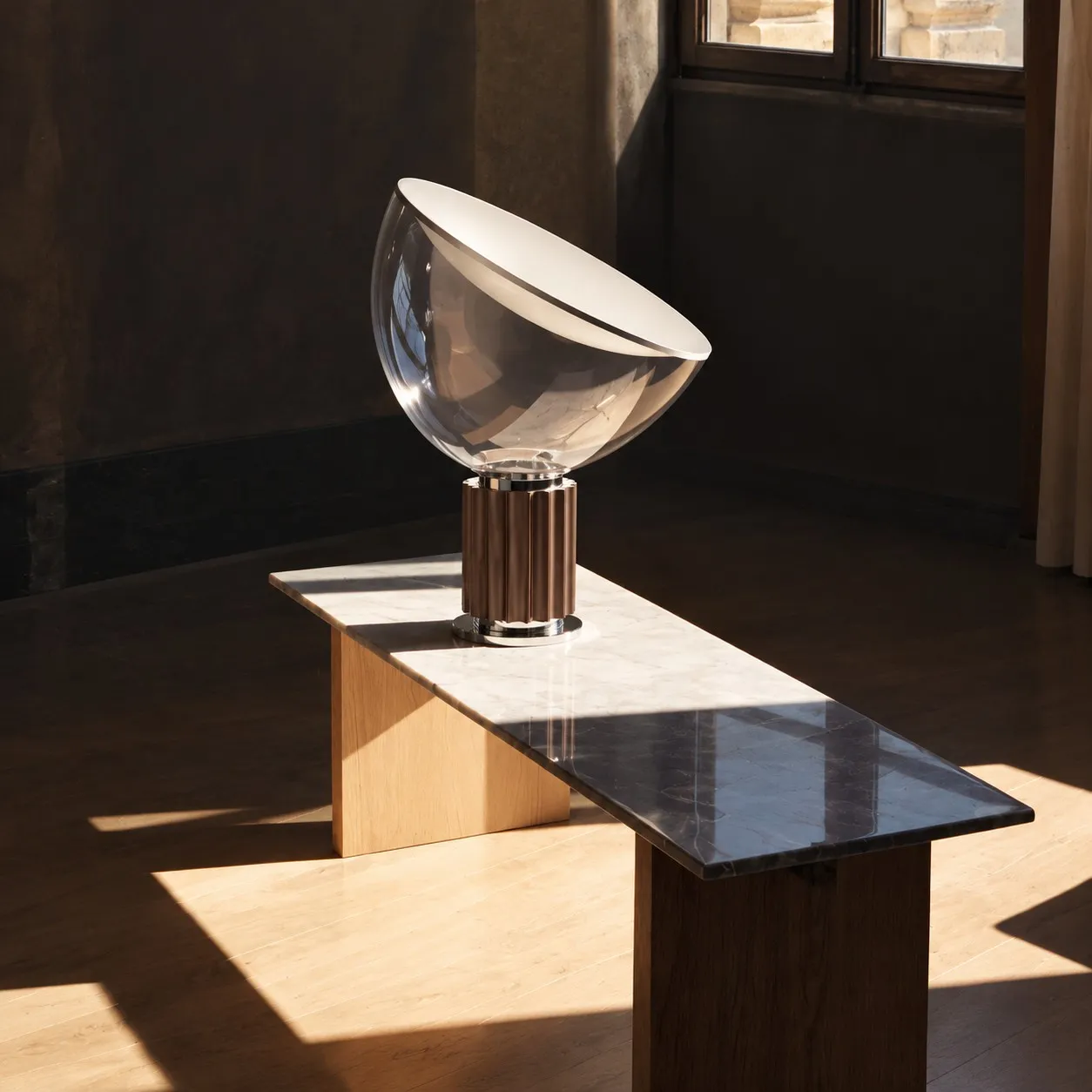 Bronze glass bowl lamp on a long console